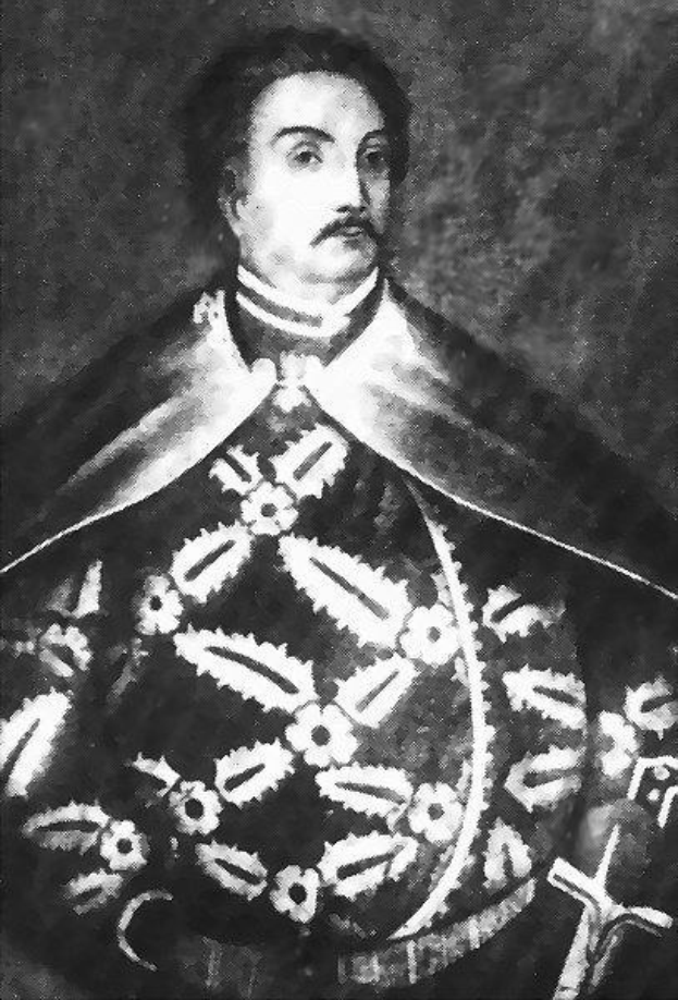 Schwarzes und weißes Foto von Papst Johannes Paul II. in Priesterrobe, der eine schwarze Robe mit weißem Kragen und Manschetten trägt, die Hände gefaltet, ernster Gesichtsausdruck, direkter Blick.