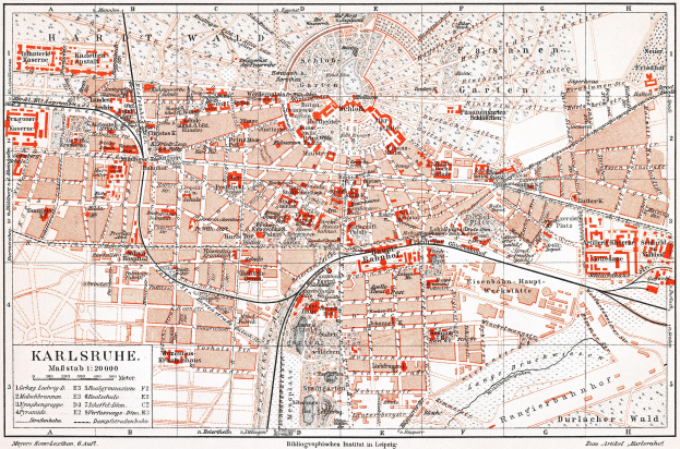 Ein detaillierter Stadtplan von Karlsruhe, Deutschland aus dem Jahr 1900, mit Text und umfassender Stadtaufteilung.