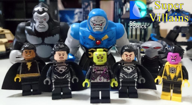 Toys in black, yellow, and blue on a white surface with text.